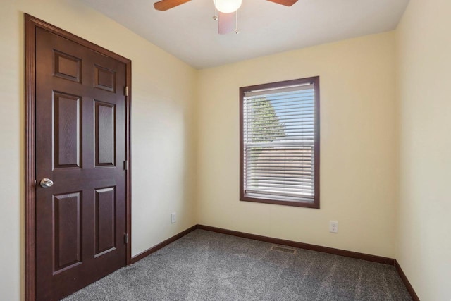 carpeted empty room with ceiling fan