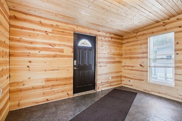 foyer with wooden walls and wooden ceiling