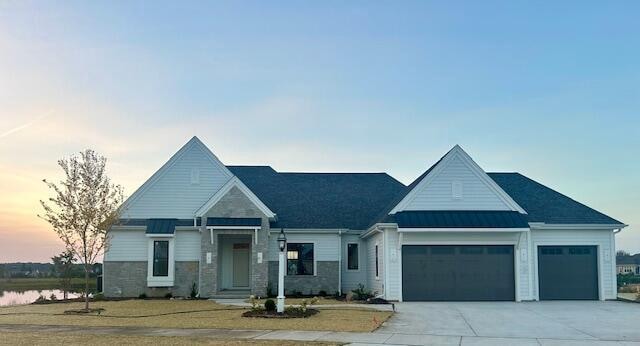 view of front of home featuring a yard and a garage