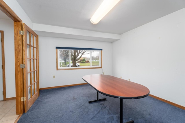 unfurnished office featuring light colored carpet