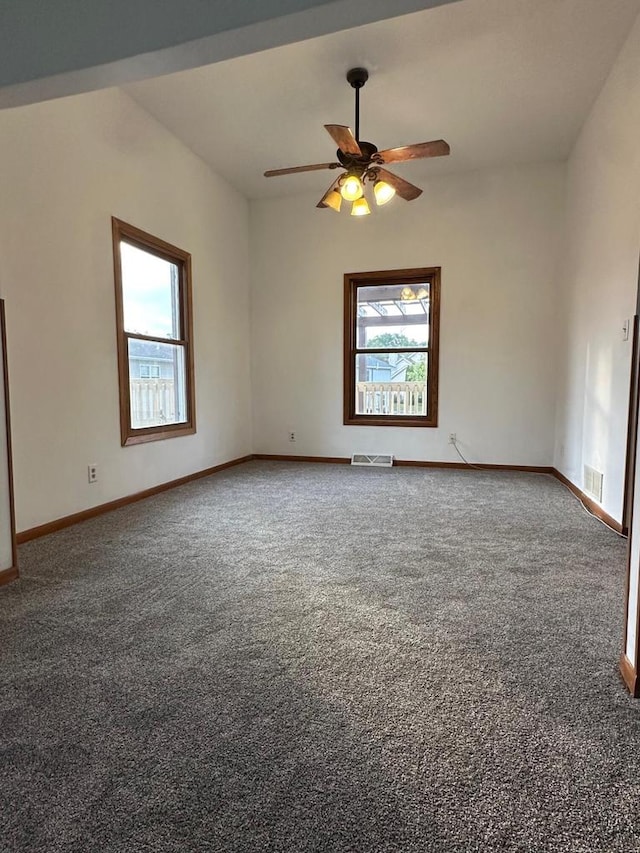 carpeted spare room with ceiling fan