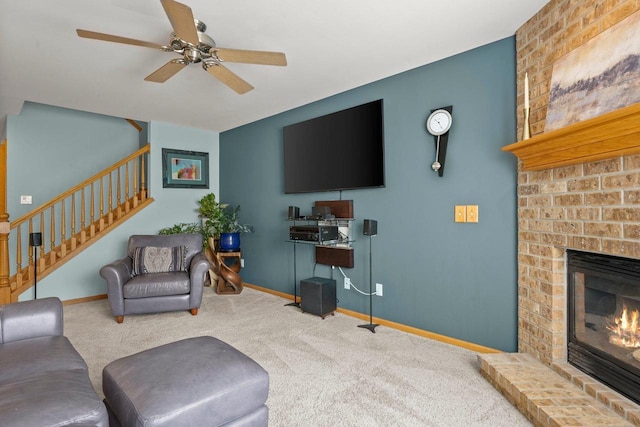 carpeted living room with a brick fireplace and ceiling fan