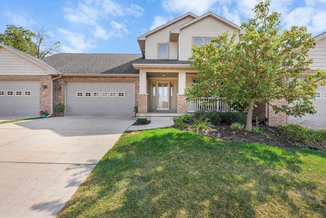 view of front of home featuring a front yard and a garage