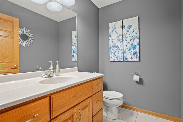 bathroom featuring vanity, toilet, and tile patterned flooring