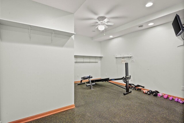 exercise room with ceiling fan