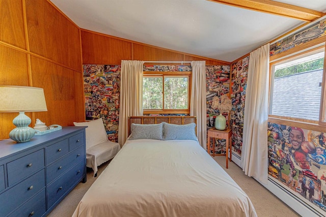 bedroom with a baseboard radiator, vaulted ceiling, multiple windows, and wooden walls