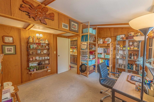 carpeted home office with wood walls and lofted ceiling