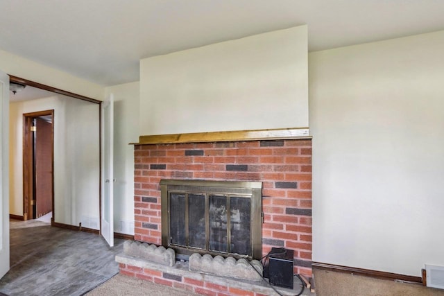 unfurnished living room with carpet floors and a fireplace