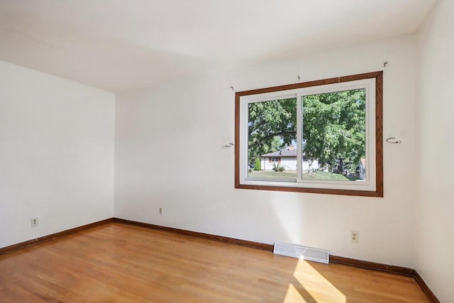 unfurnished room featuring light hardwood / wood-style floors