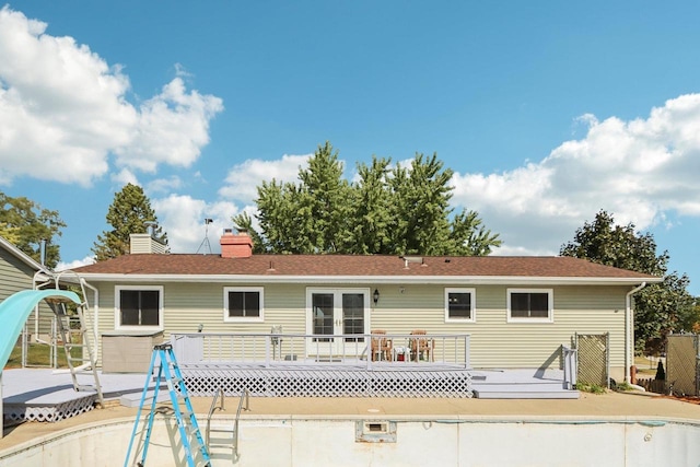 rear view of house with a wooden deck