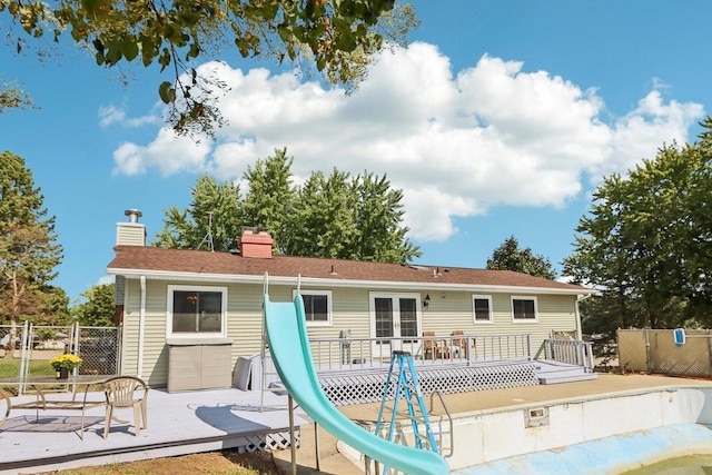 back of house with a wooden deck