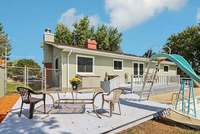 rear view of property with a deck