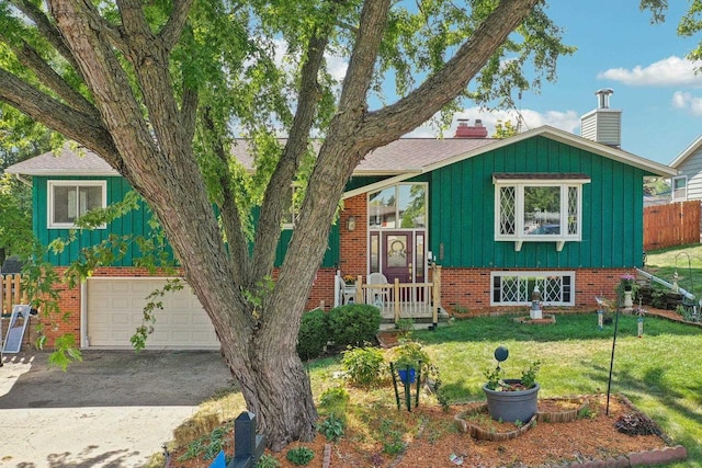 view of front facade with a front lawn and a garage