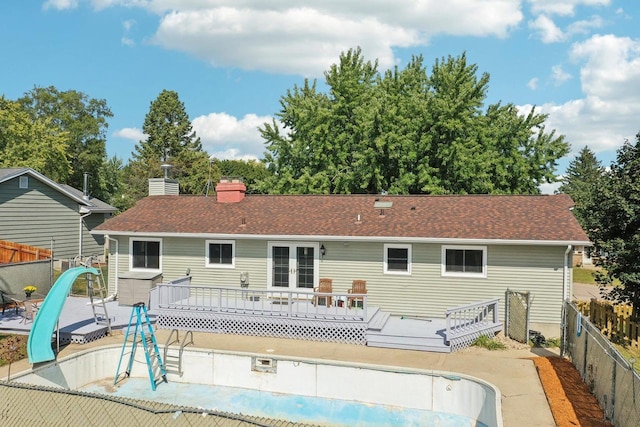 back of property featuring a wooden deck