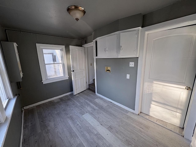 interior space featuring white cabinets and wood-type flooring