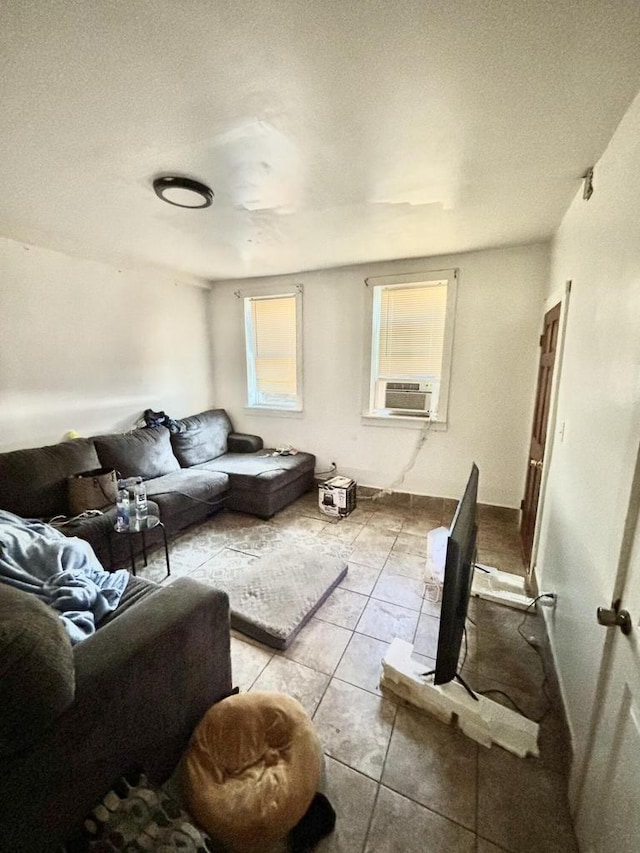 tiled living room with cooling unit and a textured ceiling