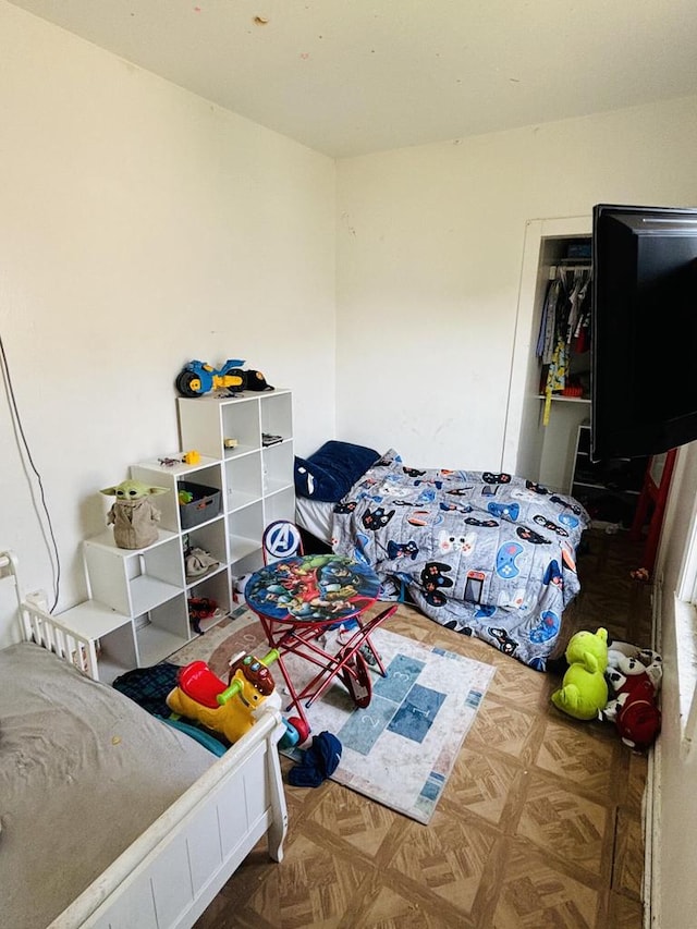 bedroom featuring parquet floors