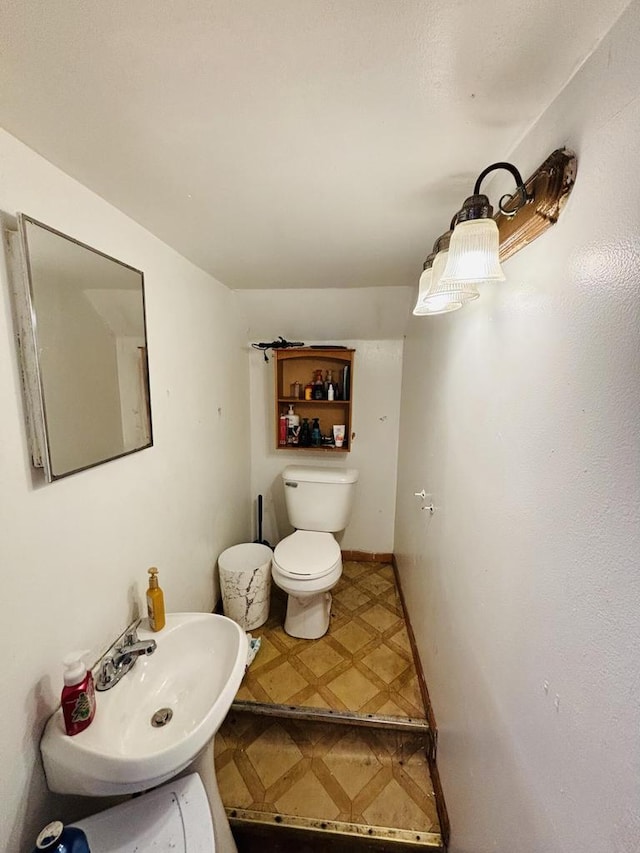 bathroom with toilet and sink