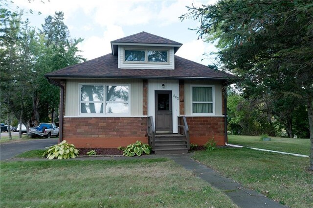 bungalow with a front yard