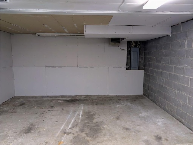 basement featuring electric panel