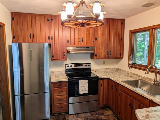 kitchen featuring pendant lighting, an inviting chandelier, stainless steel appliances, and sink