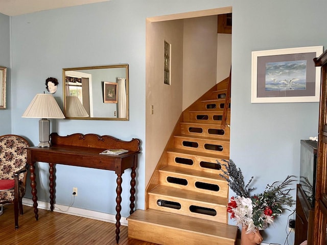 stairs with wood-type flooring