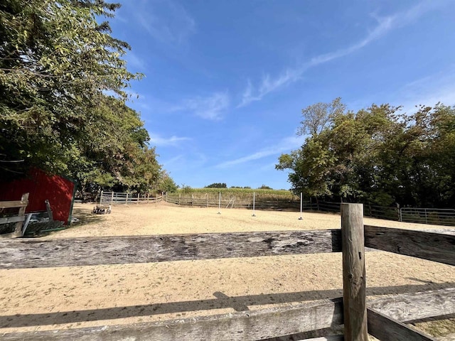 view of yard with a rural view