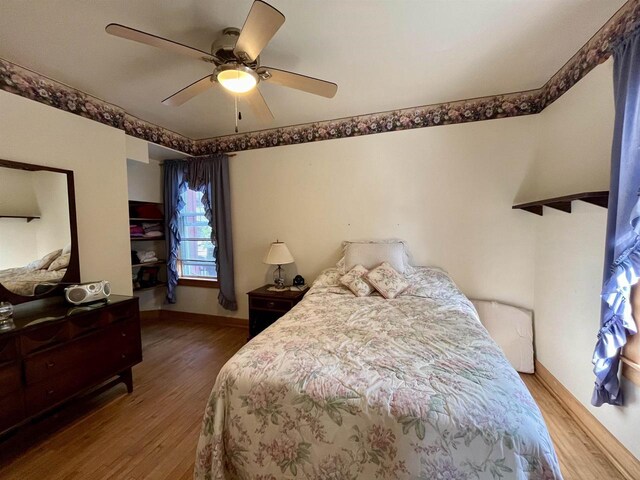 bedroom featuring ceiling fan and wood-type flooring