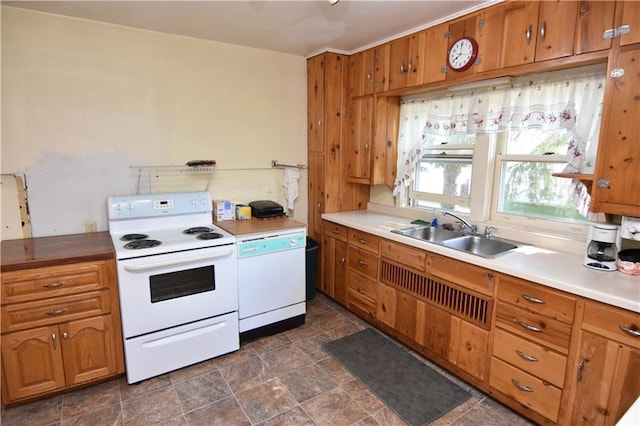 kitchen featuring white appliances and sink