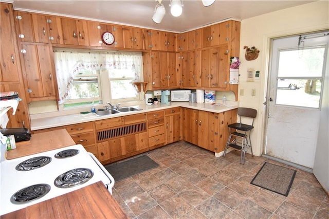 kitchen featuring white appliances and sink