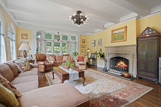 living room with ornamental molding, an inviting chandelier, dark hardwood / wood-style floors, and beam ceiling