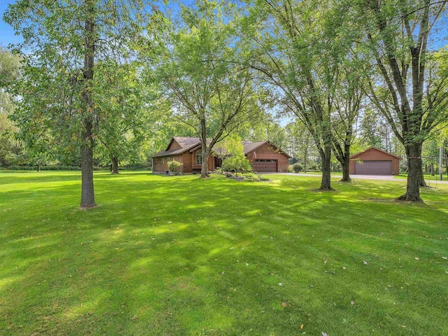 view of yard featuring a garage