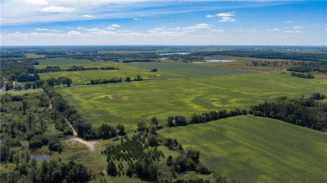 drone / aerial view featuring a rural view and a water view