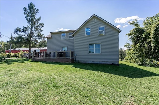 back of house featuring cooling unit, a deck, and a yard