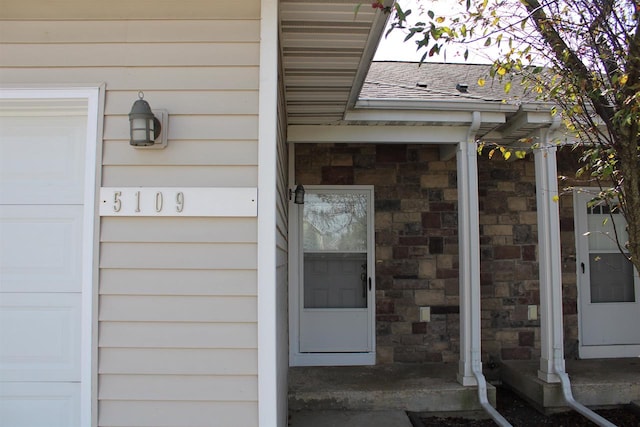 entrance to property featuring a garage