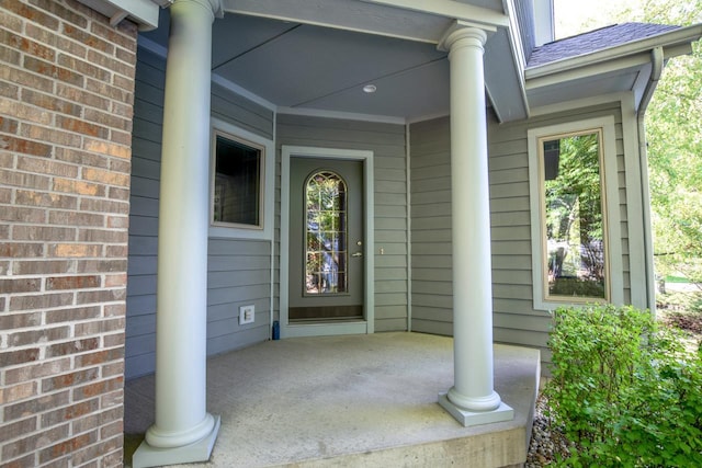 entrance to property featuring a porch