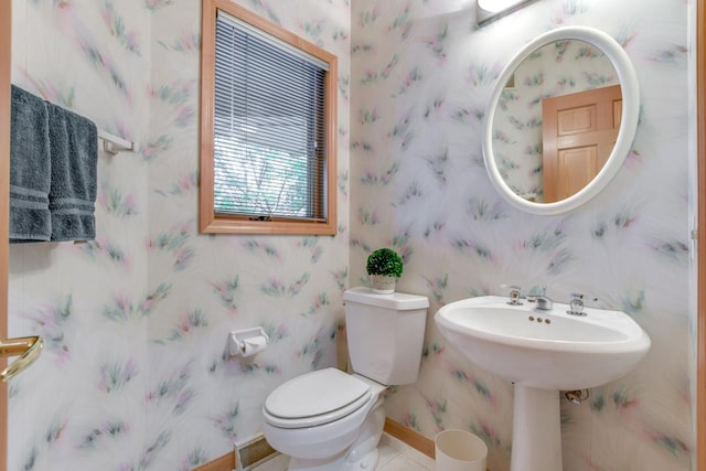 bathroom with tile patterned flooring and toilet