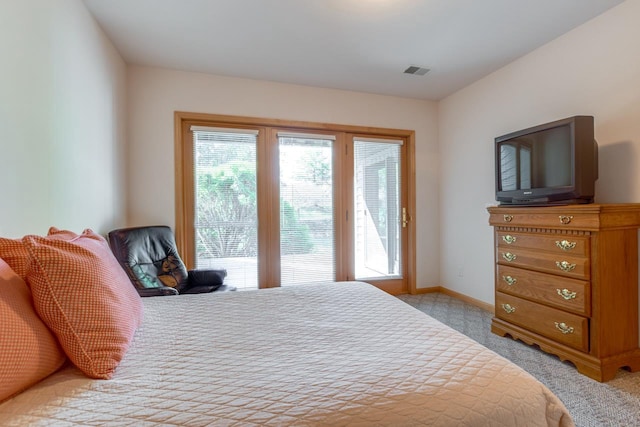 bedroom with light carpet