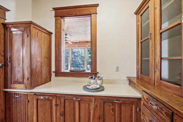 interior space featuring ceiling fan and vanity