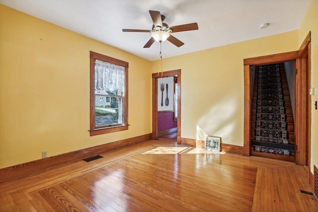 empty room with light hardwood / wood-style floors and ceiling fan