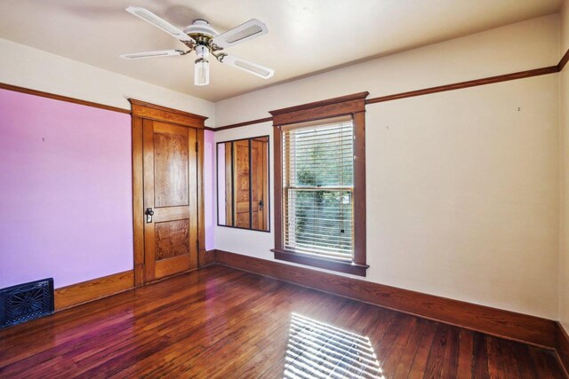 unfurnished bedroom featuring a closet, ceiling fan, and hardwood / wood-style flooring