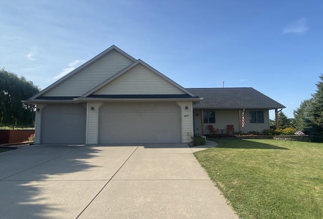 single story home with a garage and a front lawn