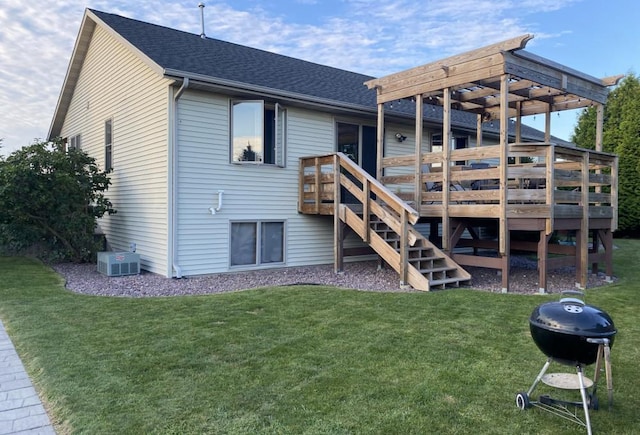 back of property with a wooden deck, a pergola, and a yard