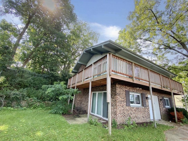 view of side of property with a lawn