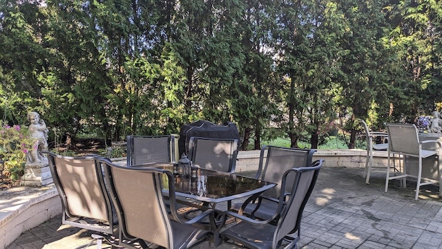 view of patio featuring outdoor dining area