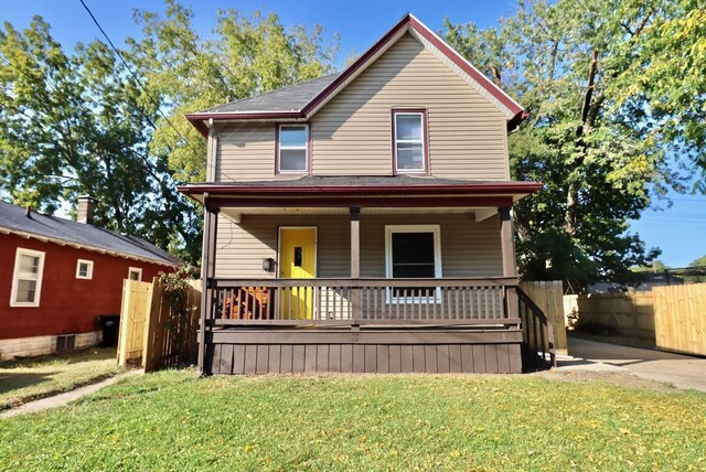 view of front of house featuring a porch and a front yard