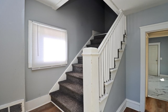 stairs with hardwood / wood-style floors