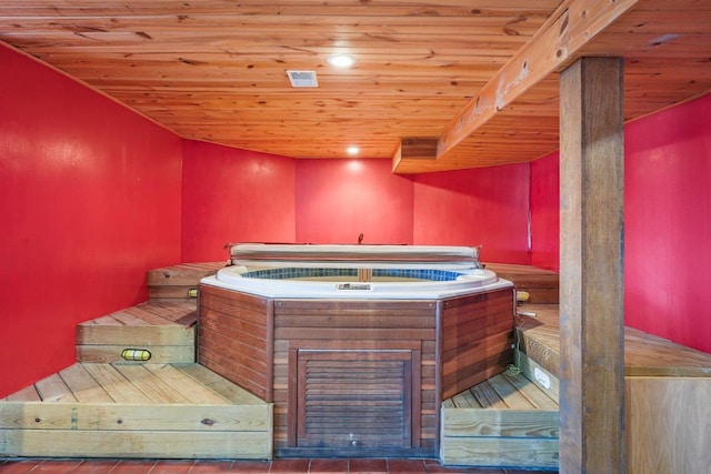 miscellaneous room featuring wood ceiling and tile patterned flooring