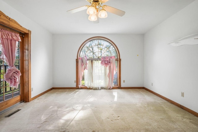 empty room with light carpet and ceiling fan