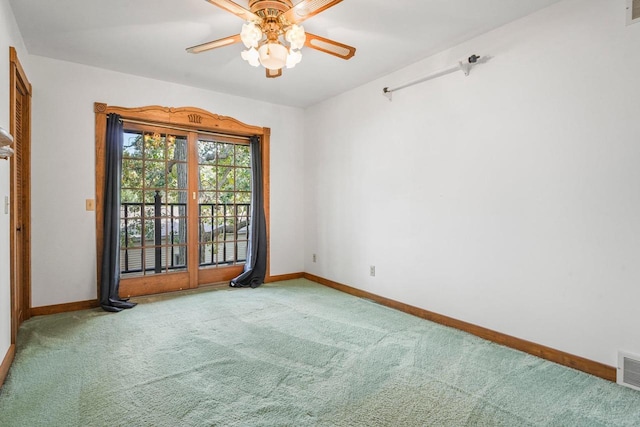 carpeted empty room with ceiling fan